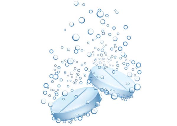 Fizzing tablet releasing carbon dioxide